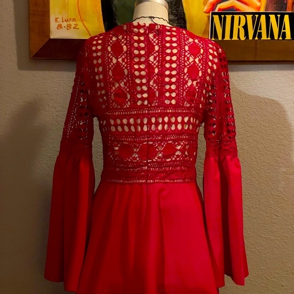 Brand new red dress, embroidered top and flows out just above the knees. - Picture 4 of 5